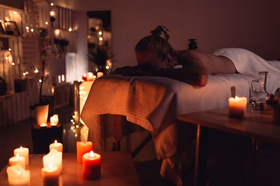 Woman lying face down on a massage bed